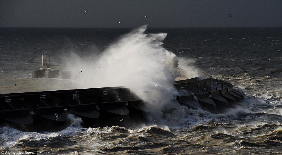 Across The Country This Morning People Walk Up to High Winds 100mph