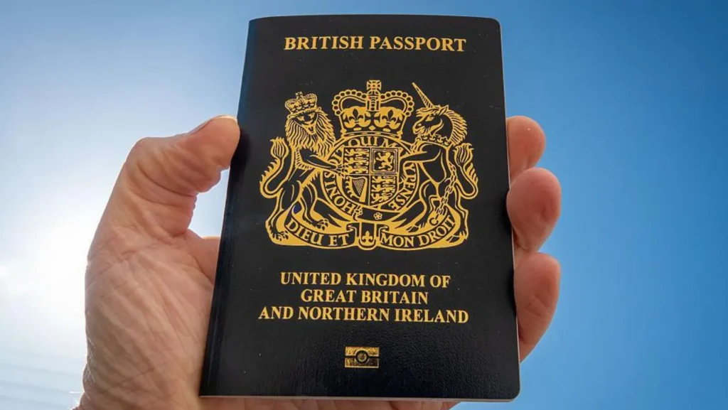 Getty Images A man holds a post-Brexit United Kingdom issued passport - the British passport is now a non-EU passport with a blue cover and a gold Royal crest.