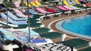Getty Images Towels on sunbeds around a swimming pool
