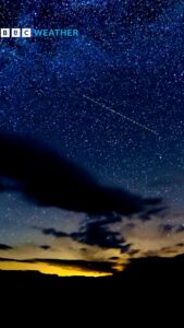 Dark clouds against a starry early morning sky