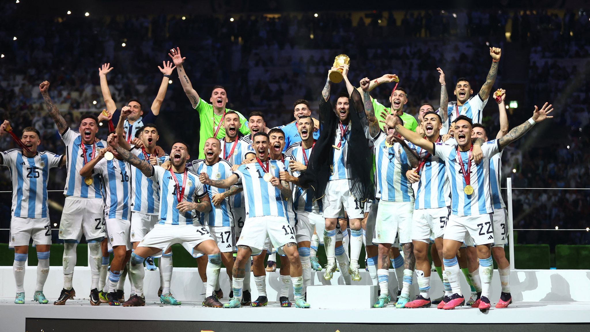 Lionel Messi lifts the 2022 World Cup with his Argentina teammates. Pic: Reuters