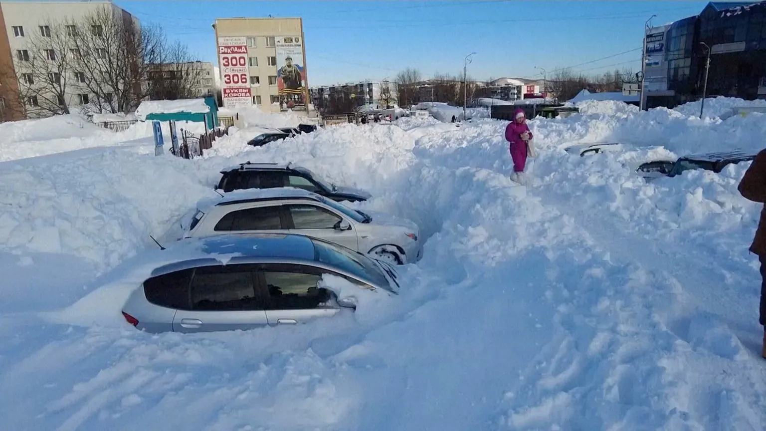 Cars deep in snow