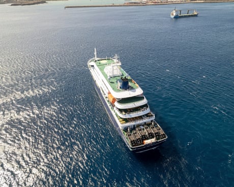 This aerial picture shows a general view of the cruise ship MV Hondius stationary off the port of Praia, the capital of Cape Verde, which has been hit by an outbreak of hantavirus.
