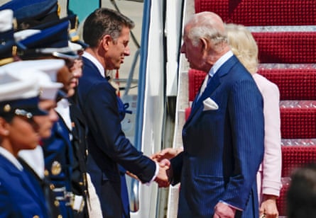 Britain's King Charles III shakes hands with United Kingdom ambassador to the U.S. Sir Christian Turner.