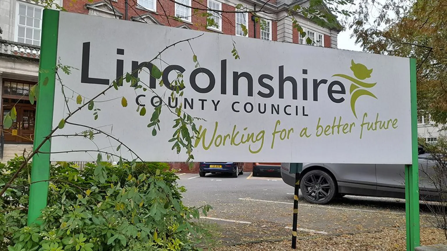 Sign saying Lincolnshire County Council Working for a Better Future outside County Hall in Lincoln