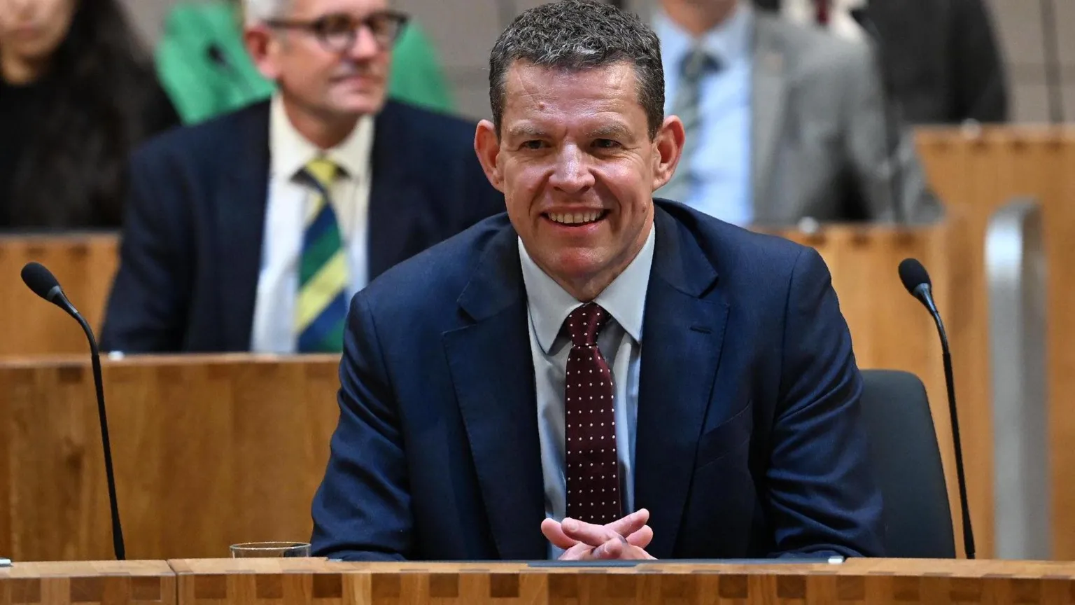 Rhun ap Iorwerth smiling in the Senedd.