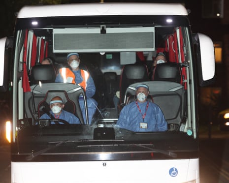 A coach of MV Hondius passengers arrive at the Arrowe Park hospital facility.