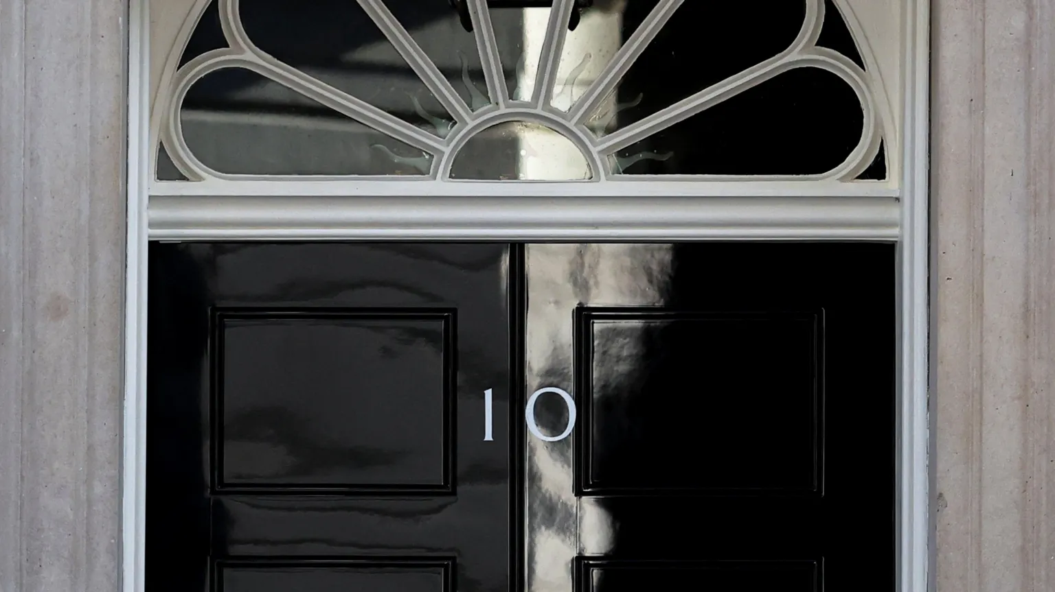 Close shot of the black No 10 Downing Street door