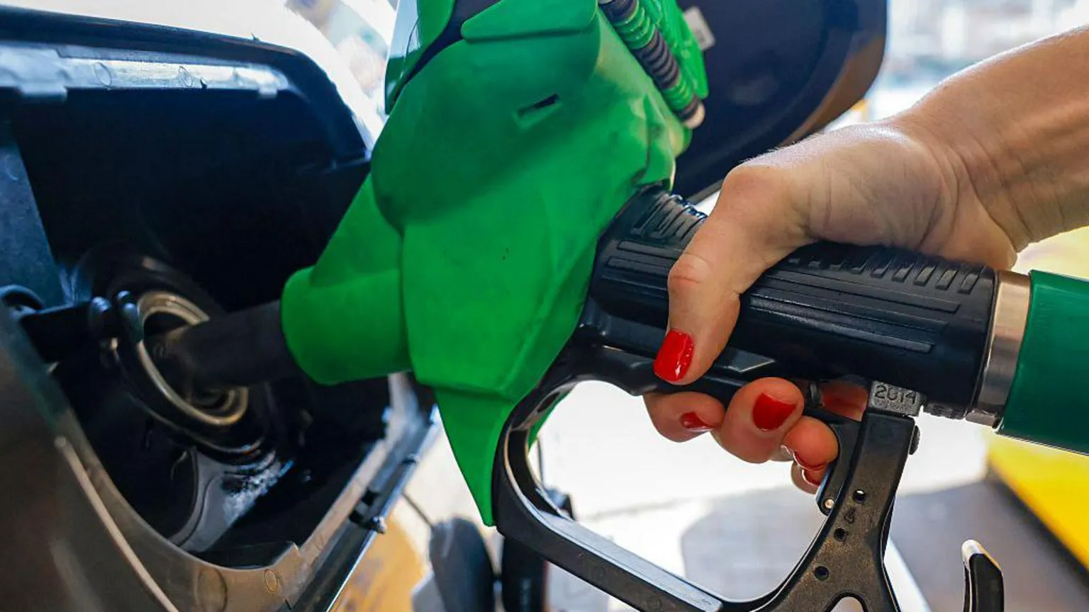 AFP via Getty Images A motorist refuels a vehicle with unleaded petrol at a Jet petrol station, a subsidiary of Phillips 66, in Brentford, north west of London.