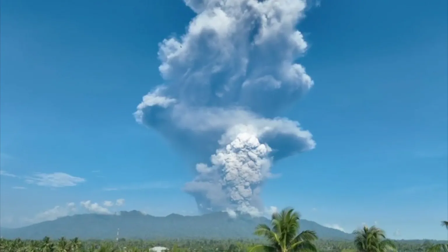 Huge plumes of white ash billow into the sky after Mount Dukono erupts