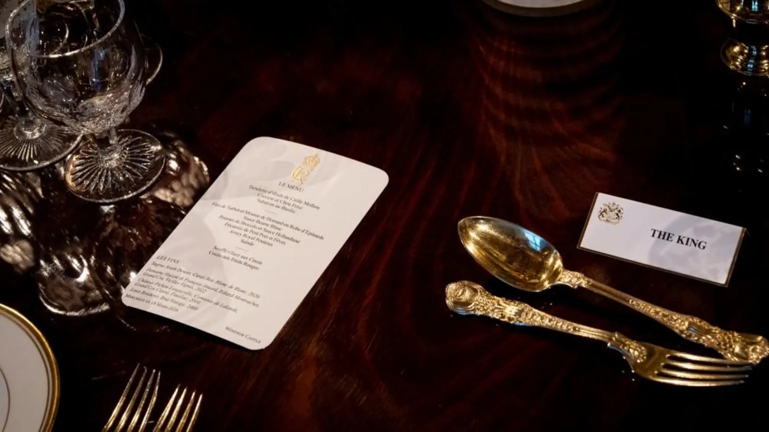 PA Media Place settings at the banquet table in St George's Hall for the banquet on white card, the cuttlery is gold and table cloth a lavish burgundy