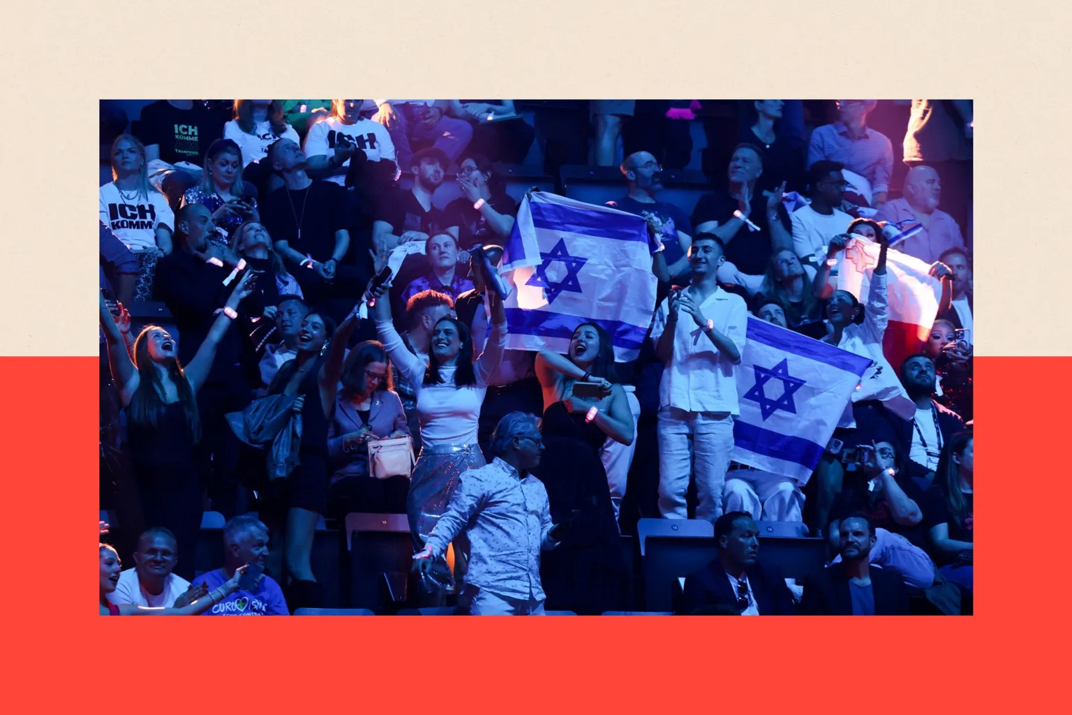 Reuters People hold Israeli flags during the second semi-final of the 2025 Eurovision Song Contest