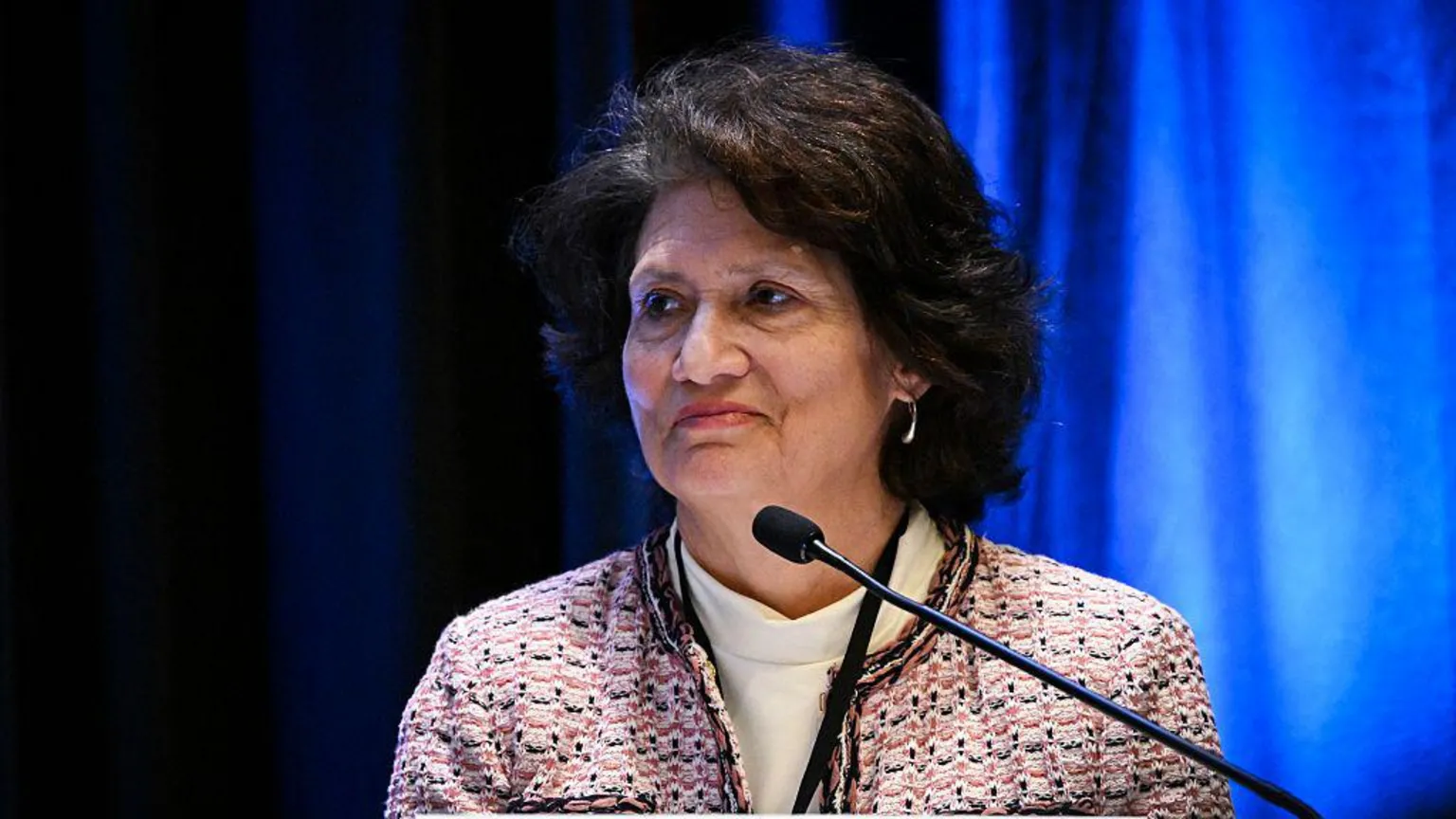 Getty Images Judge Gonzalez Rogers appears on a panel wearing a tweed jacket and white turtleneck
