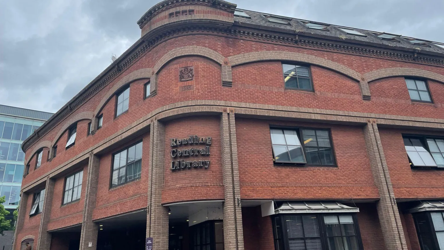 A large red bricked library building.