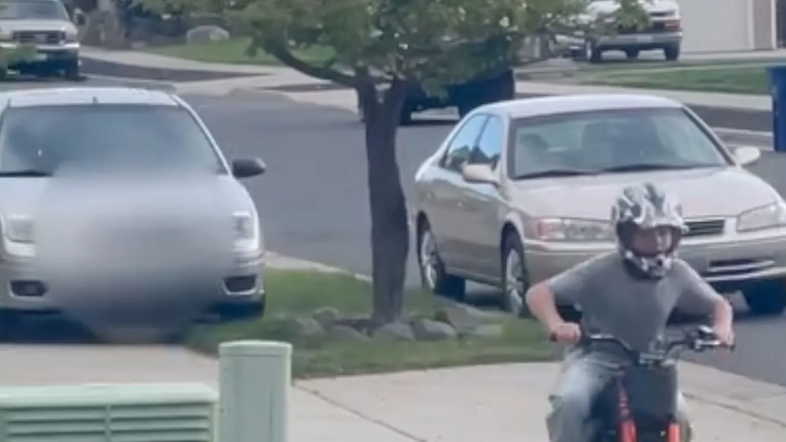 Boy riding bike trying to escape driver chasing him