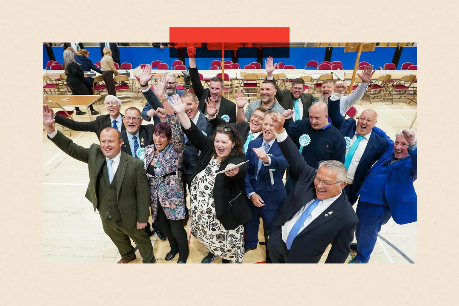 Getty Images Reform UK councillors react after winning seats in all of the 12 contested wards in the Hartlepool Local election. They are pictured from slightly above and many of them have a hand in the air in celebration.
