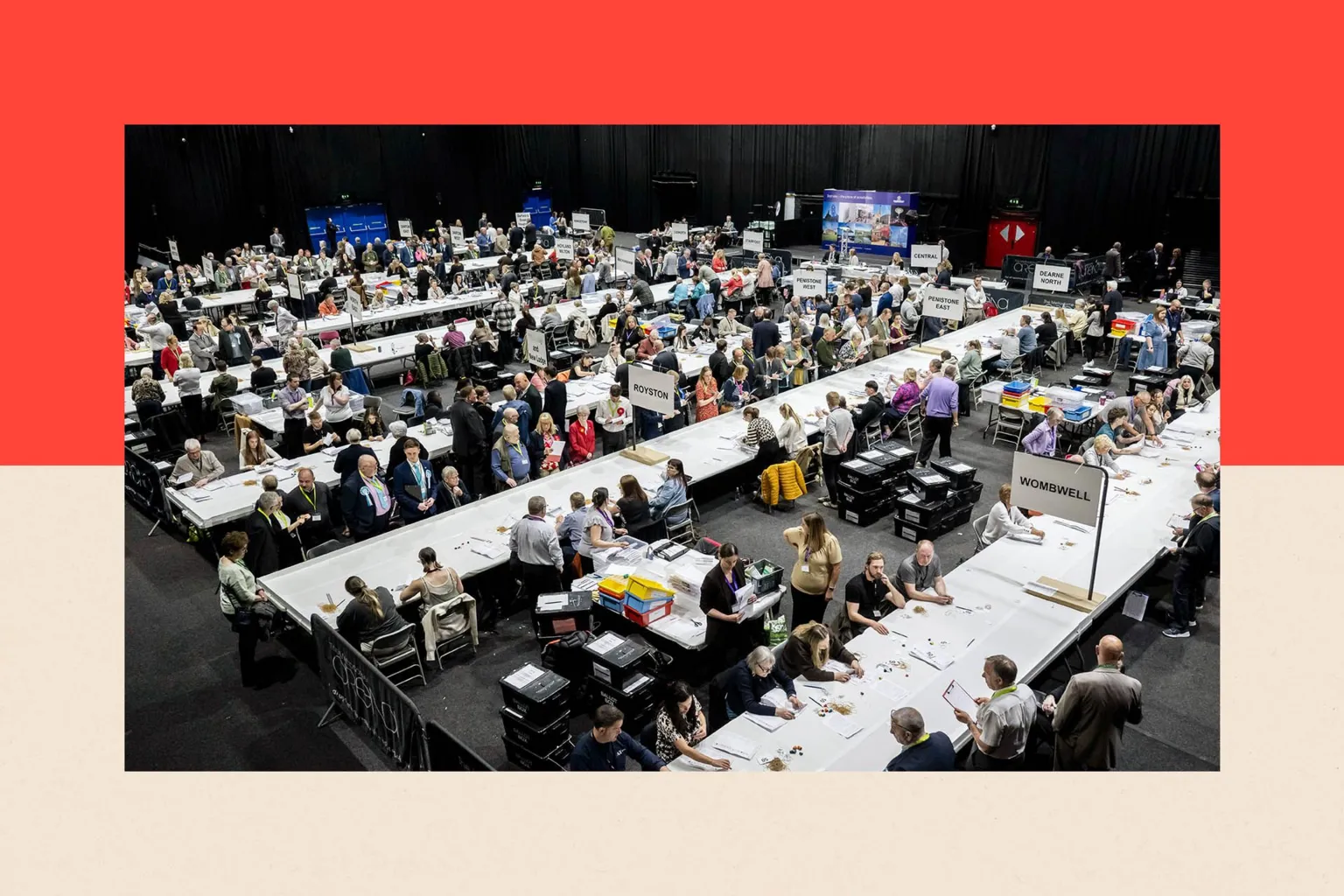 Getty Images Verification of ballots gets underway at Barnsley Metrodome. There are rows of long white tables stretching diagonally across the picture with count officials sat at them.
