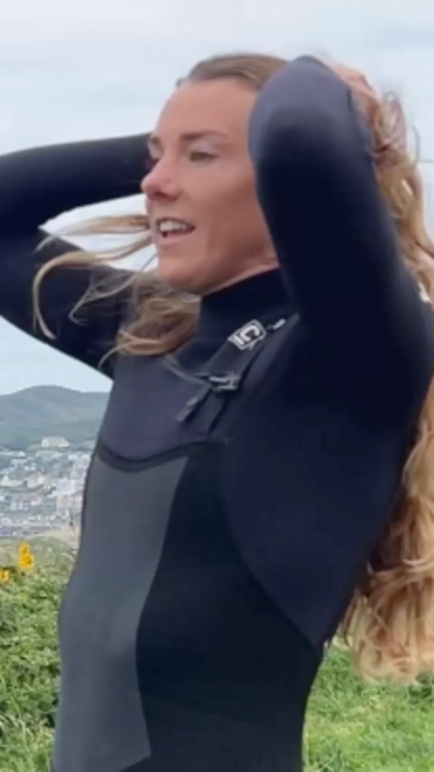 Lucy Campbell in a wetsuit ready to surf
