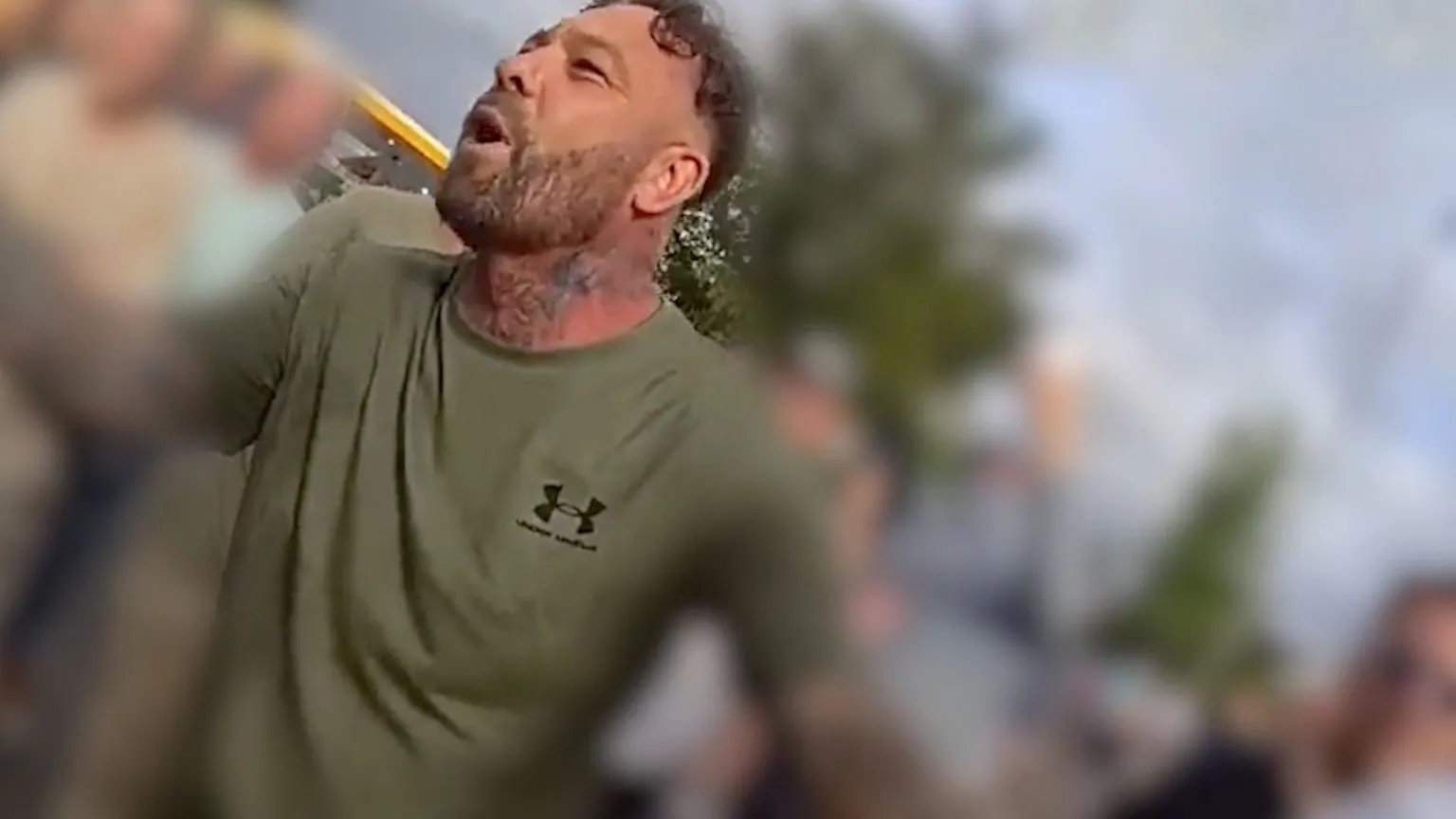 A screen grab of police body cam footage showing a man taking part in a protest.