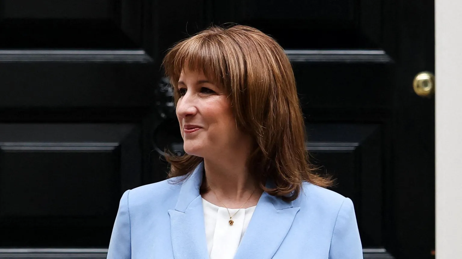 Reuters Rachel Reeves pictured outside No 11 Downing Street, wearing a light blue suit