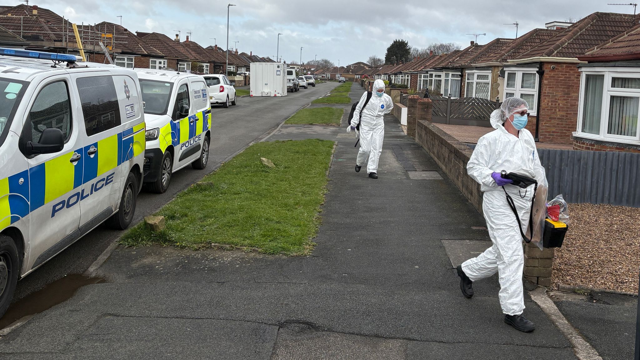 Police forensics officers at the scene. Pic: PA