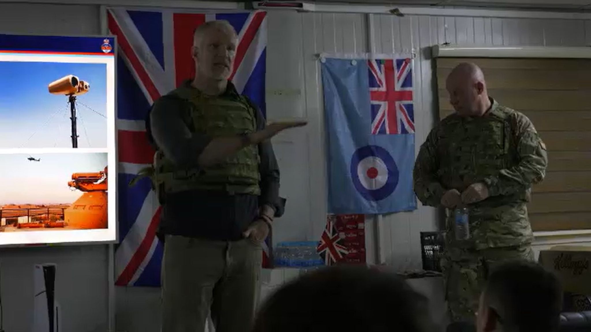 Alistair Carns and Air Chief Marshal Smyth speaking to the troops at the base