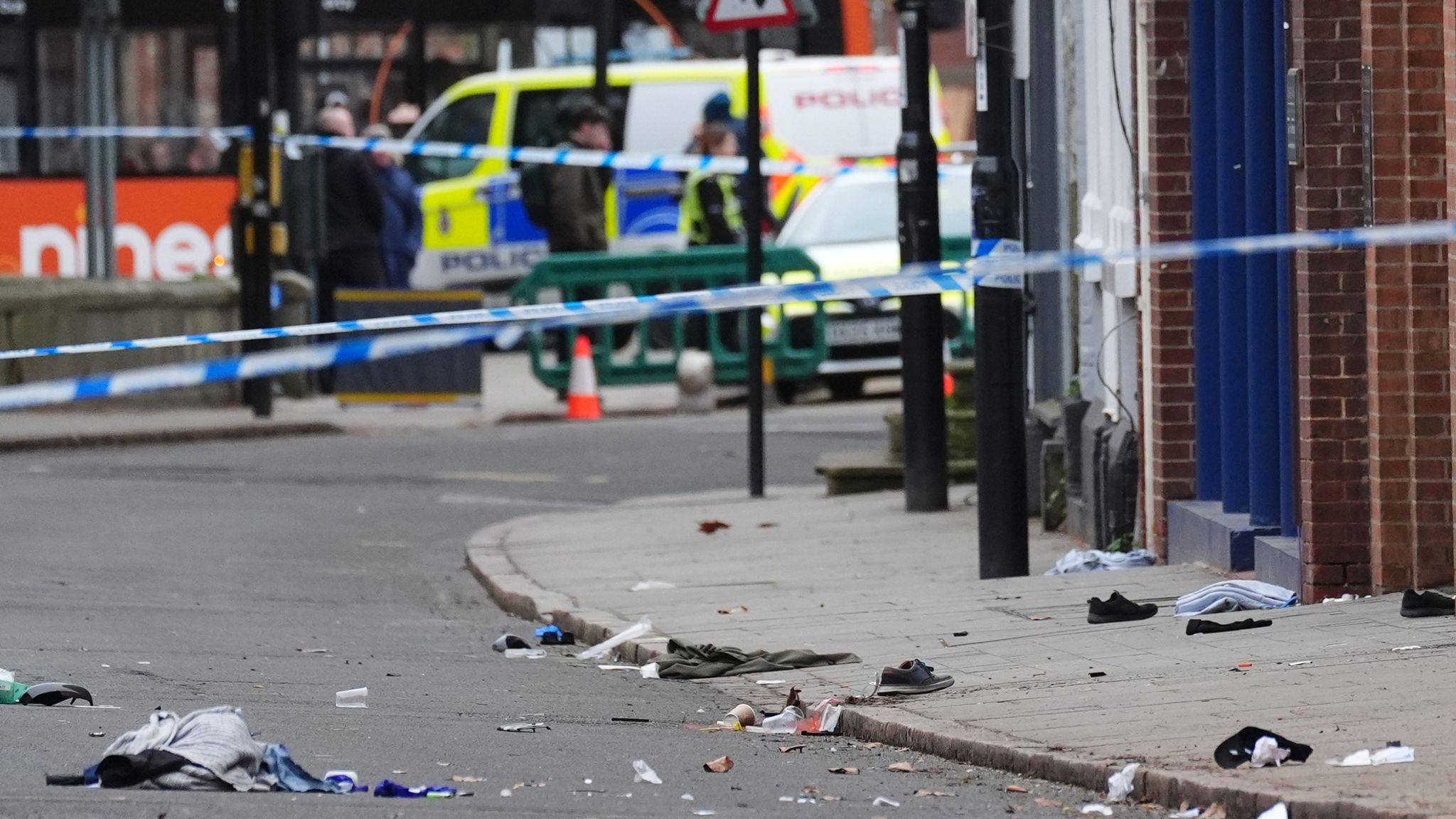 Shoes and blankets visible on the ground as evidence of the collision's aftermath. Pic: PA