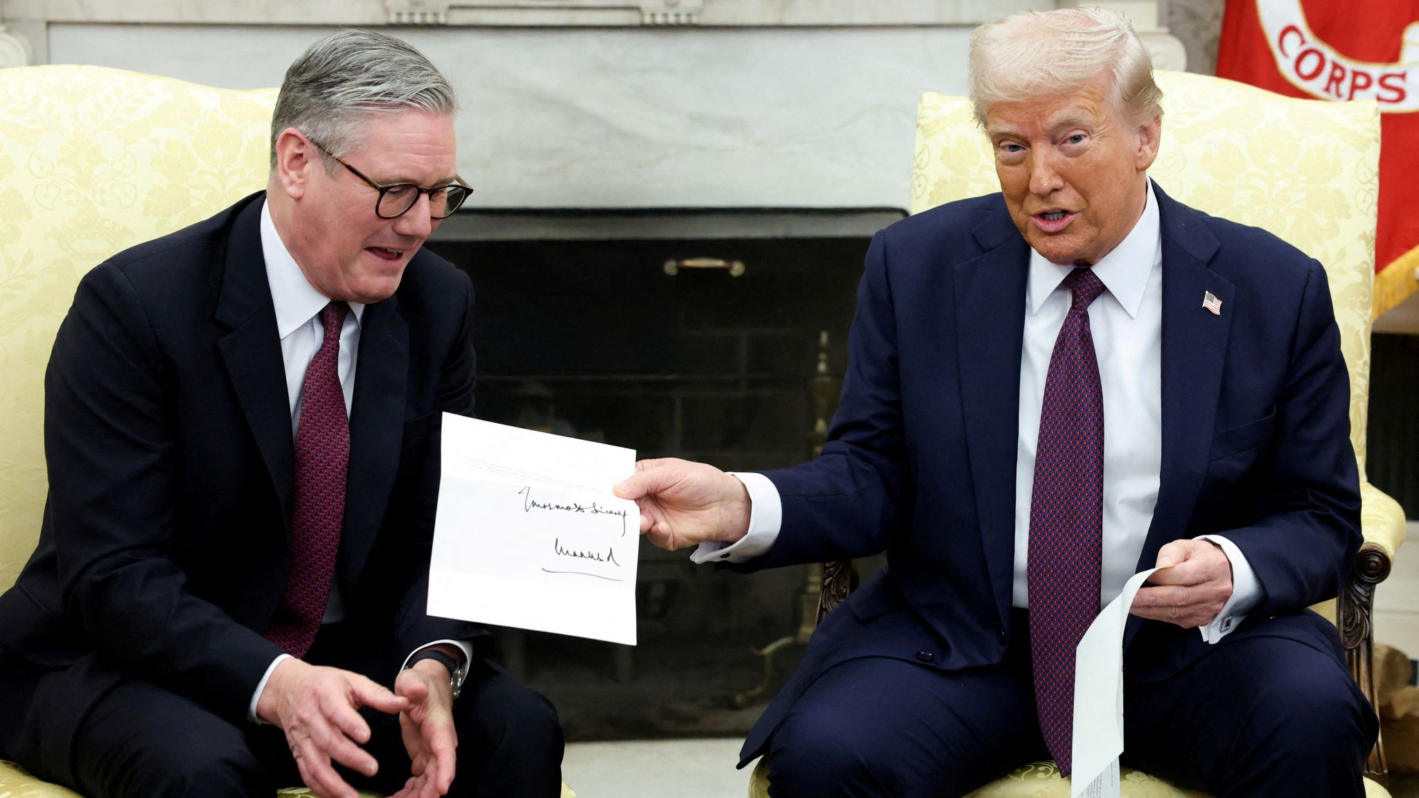 Sir Keir Starmer gives Donald Trump a letter from King Charles inviting him to visit the UK in September 2025. Pic: Reuters