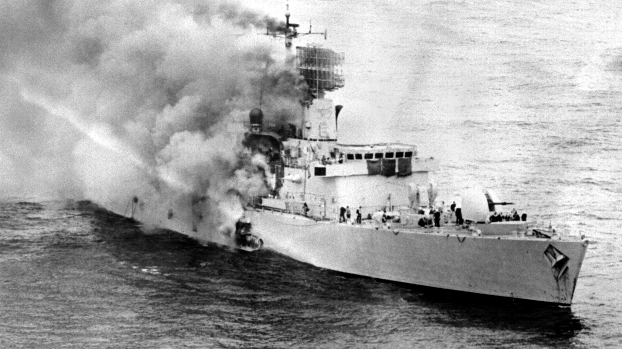Smoke pours from HMS Sheffield after she was hit by an Argentinian missile. File pic: PA