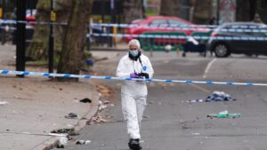 A forensic investigator at the scene of the collision. Pic: PA