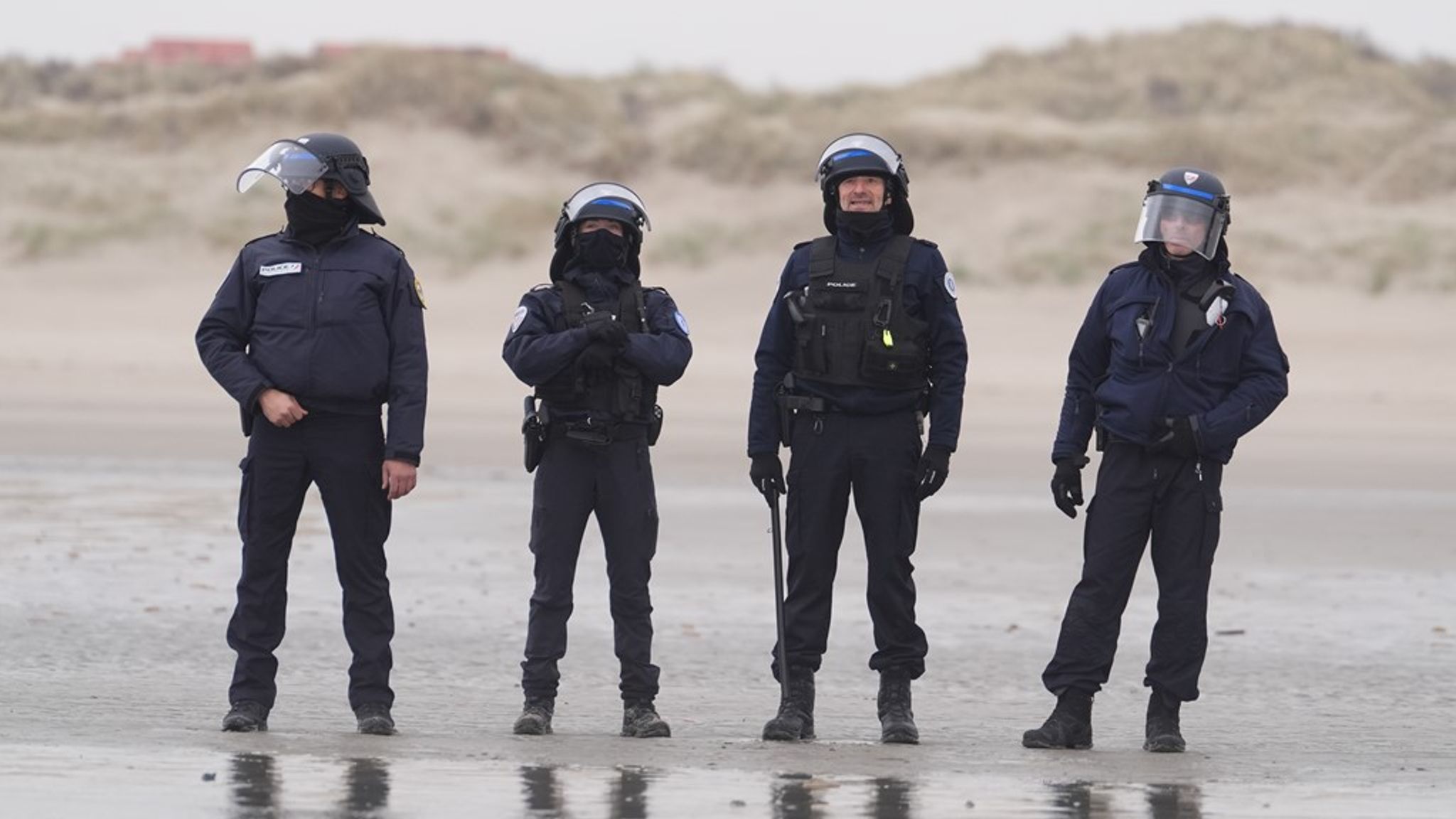French authorities on the beach in Gravelines, France, where migrants are boarding small boats in an attempt to cross the Channel. Pic: PA