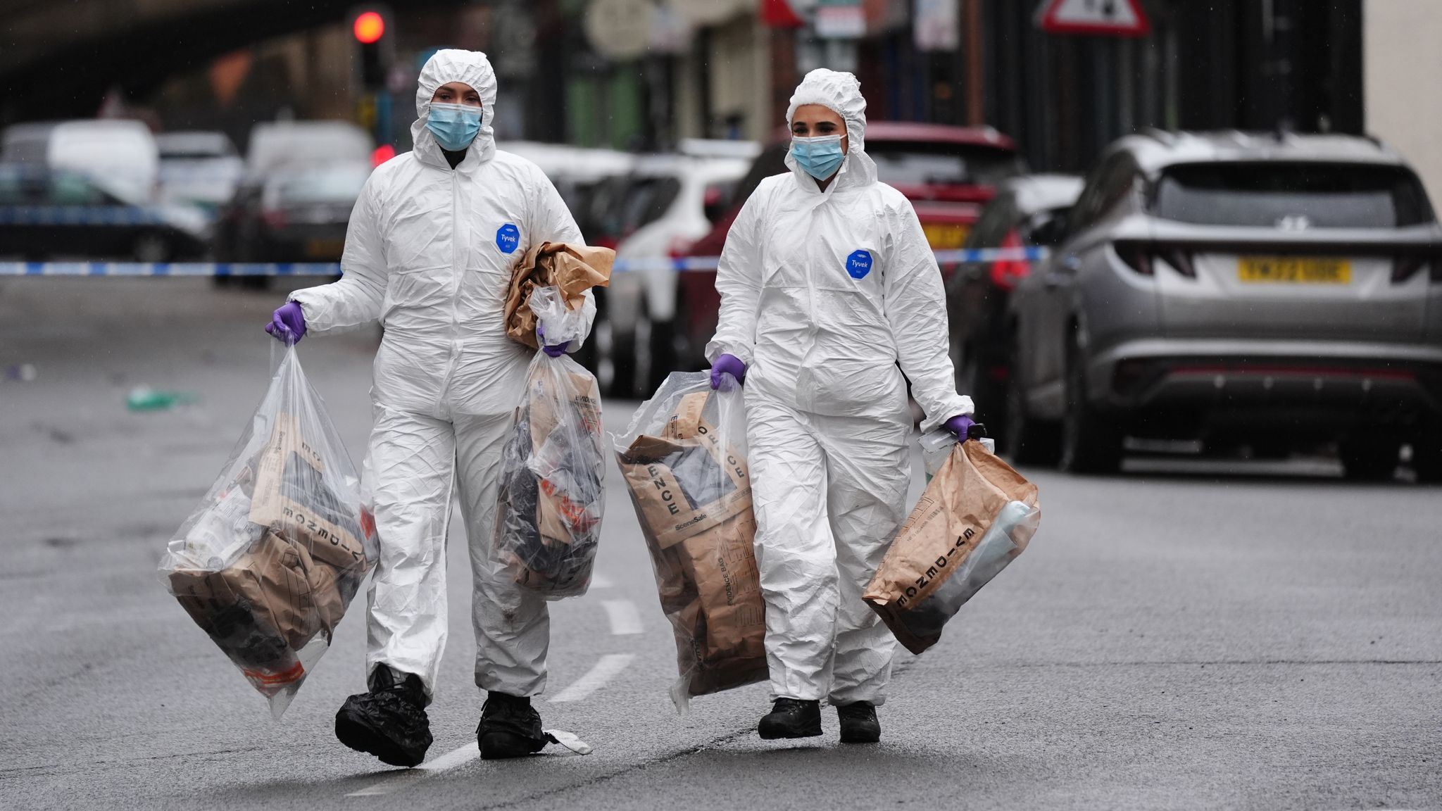 Evidence bags are gathered from the scene in Friar Gate. Pic: PA