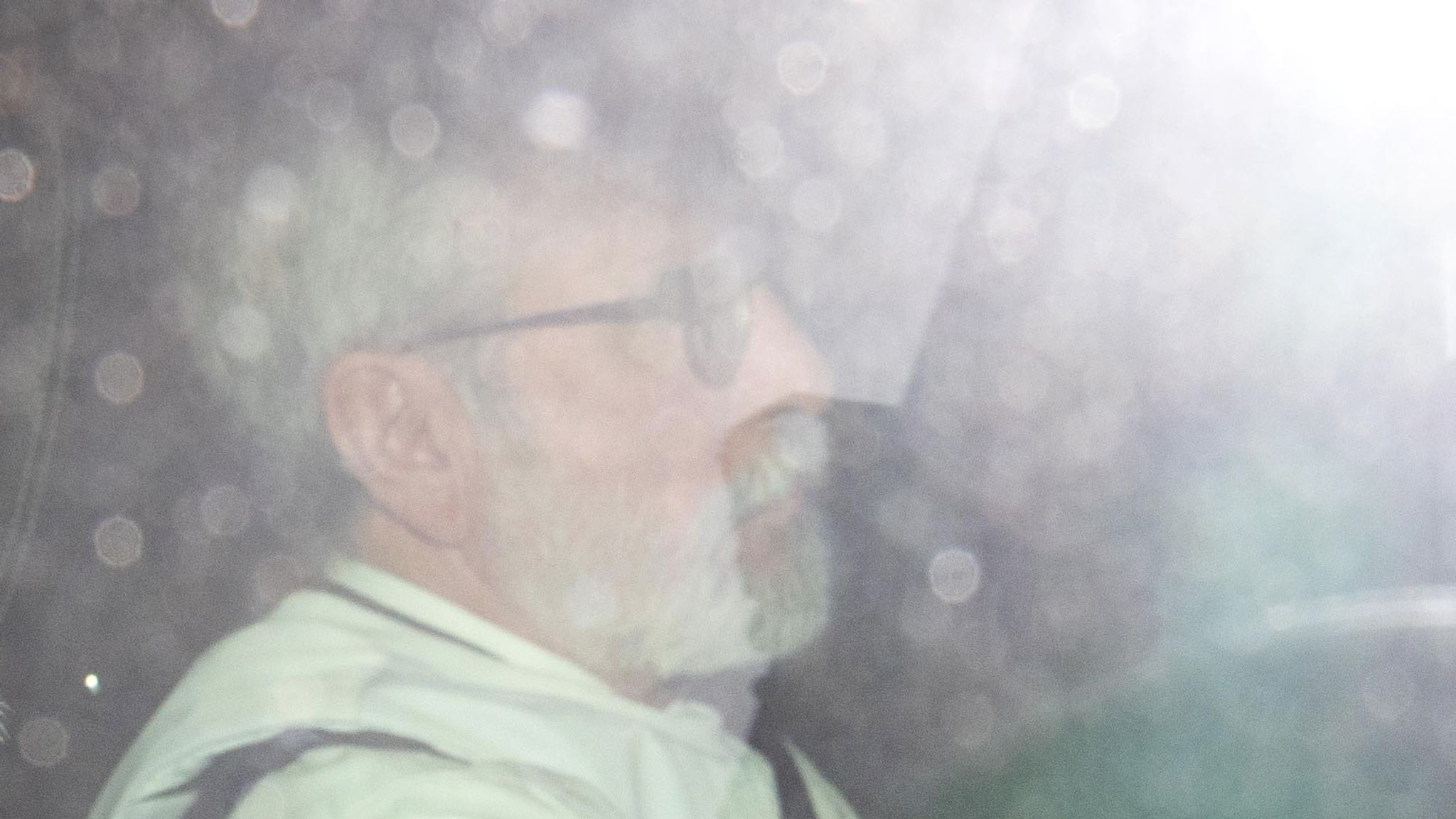 Mr Adams appeared to be wearing protective equipment as he arrived at court. Pic: PA