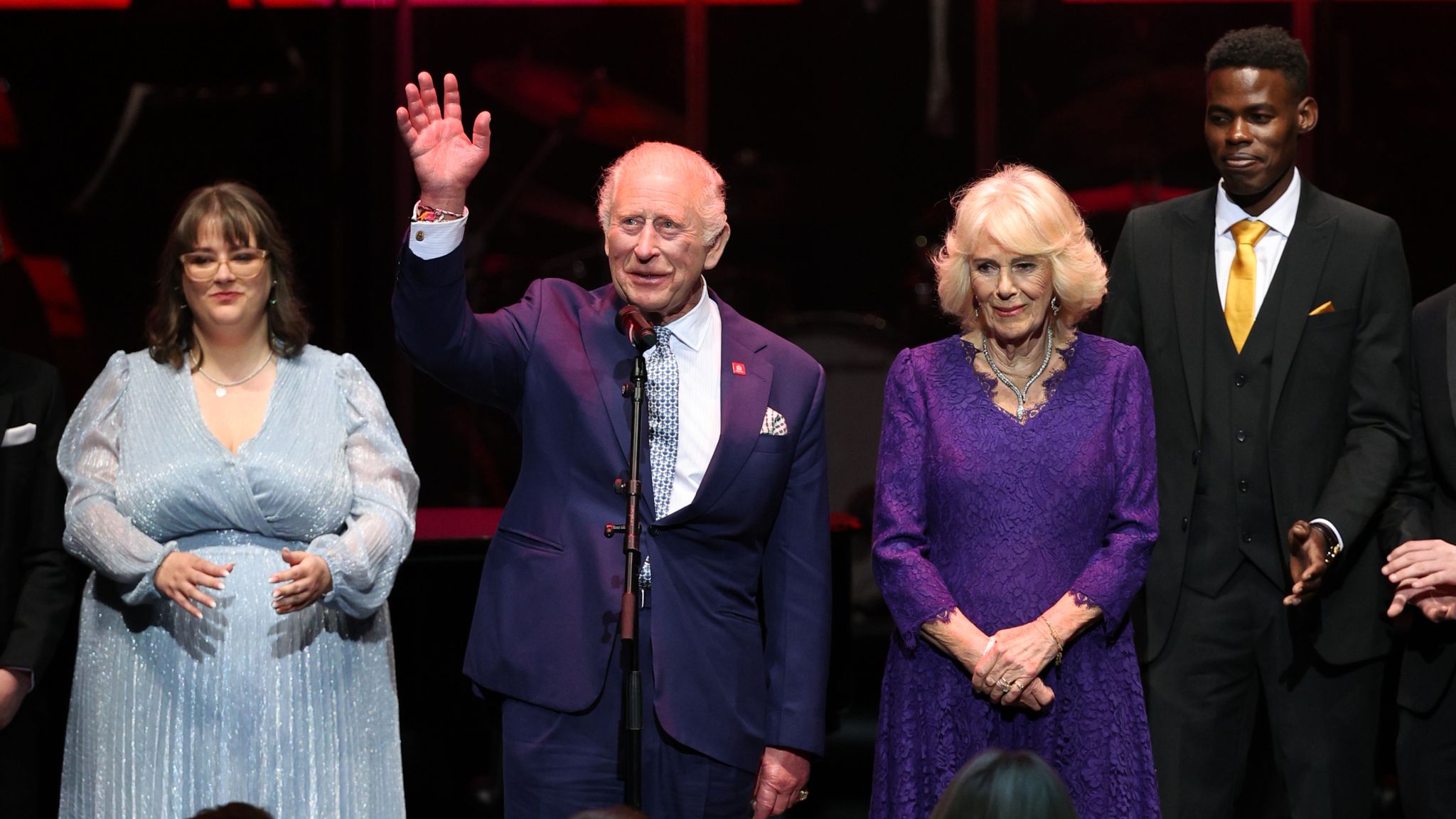 The King and Queen on stage at the event. Pic: PA