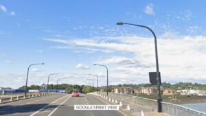 Teenage motorcyclist dies after collision with car - as two people arrested