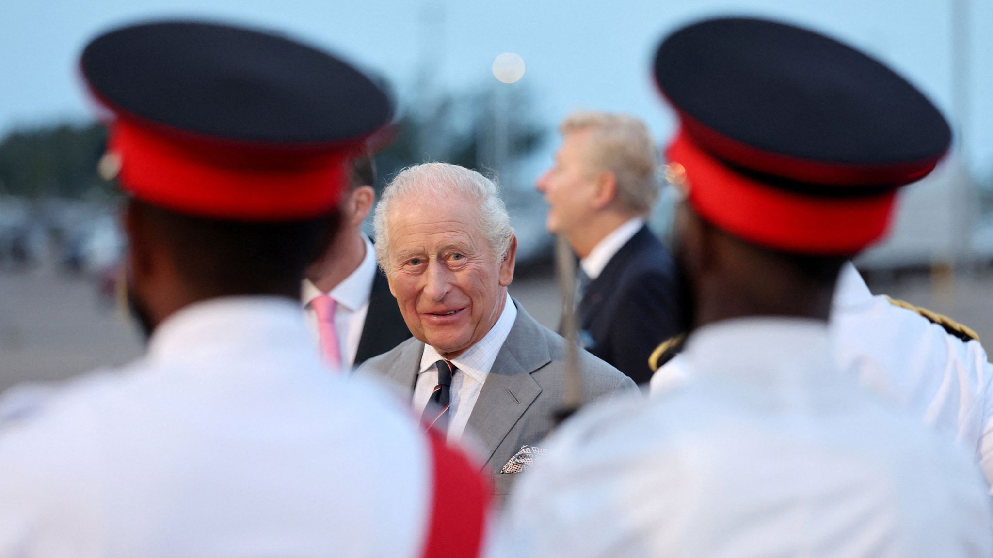 The King was greeted on arrival by a small guard of honour. Pic: Reuters
