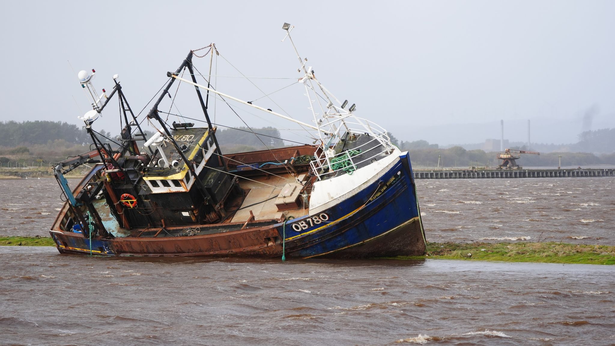 A stranded fishing boat at Irvine Harbour in Ayrshire. Pic: PA